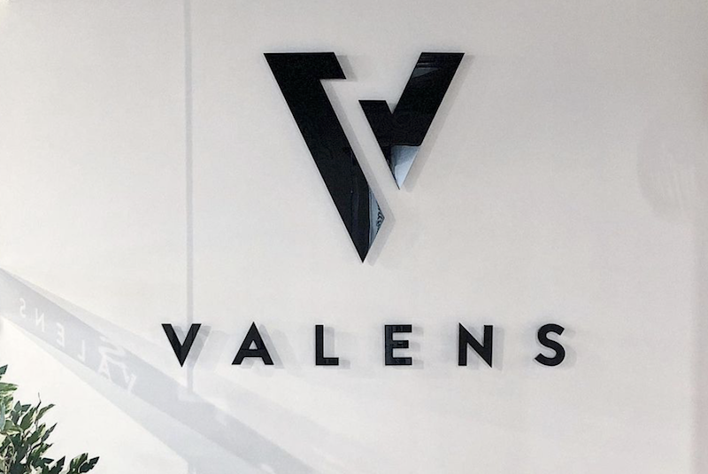 The Valens Company logo on a wall